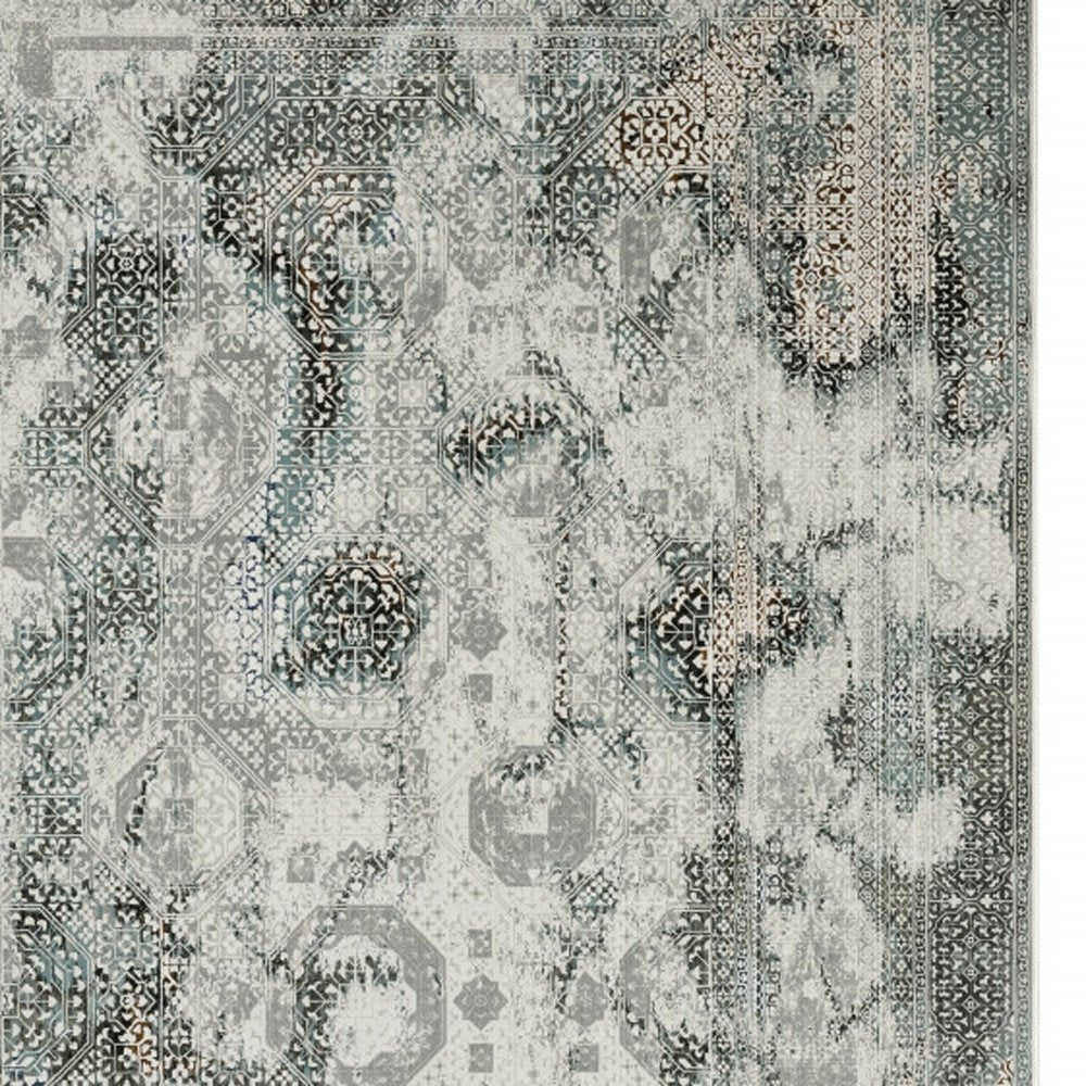 6' X 9' Ivory Grey Charcoal Blue And Rust Oriental Power Loom Stain Resistant Area Rug