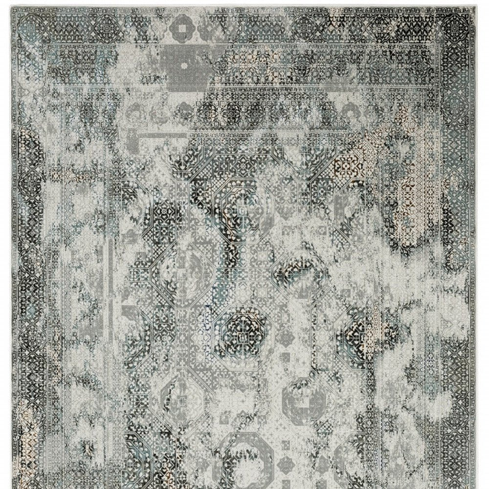 6' X 9' Ivory Grey Charcoal Blue And Rust Oriental Power Loom Stain Resistant Area Rug