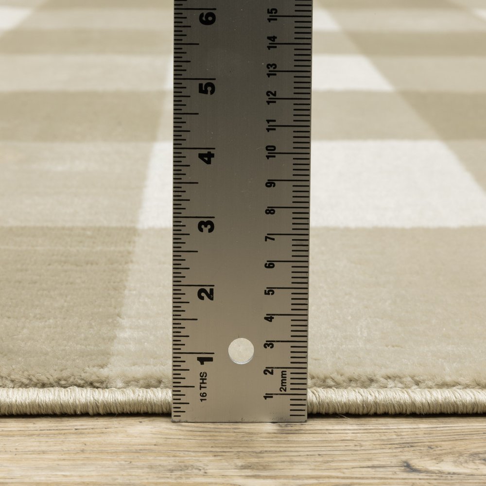 5' X 7' Beige And Ivory Geometric Power Loom Stain Resistant Area Rug