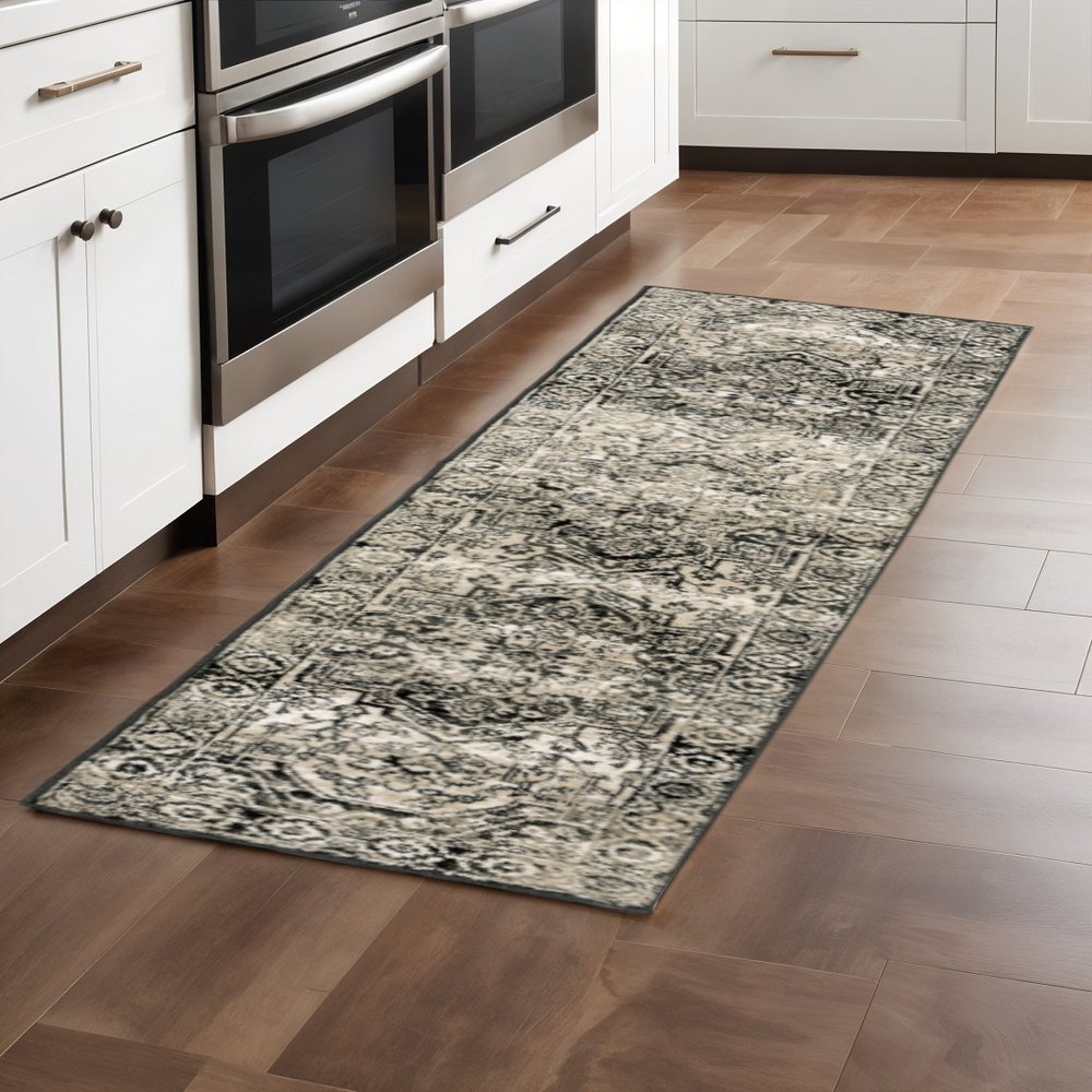 4' X 6' Black Grey Tan And Ivory Oriental Power Loom Stain Resistant Area Rug