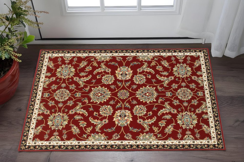 2' X 4' Red Black Blue Ivory Green And Salmon Oriental Power Loom Stain Resistant Area Rug