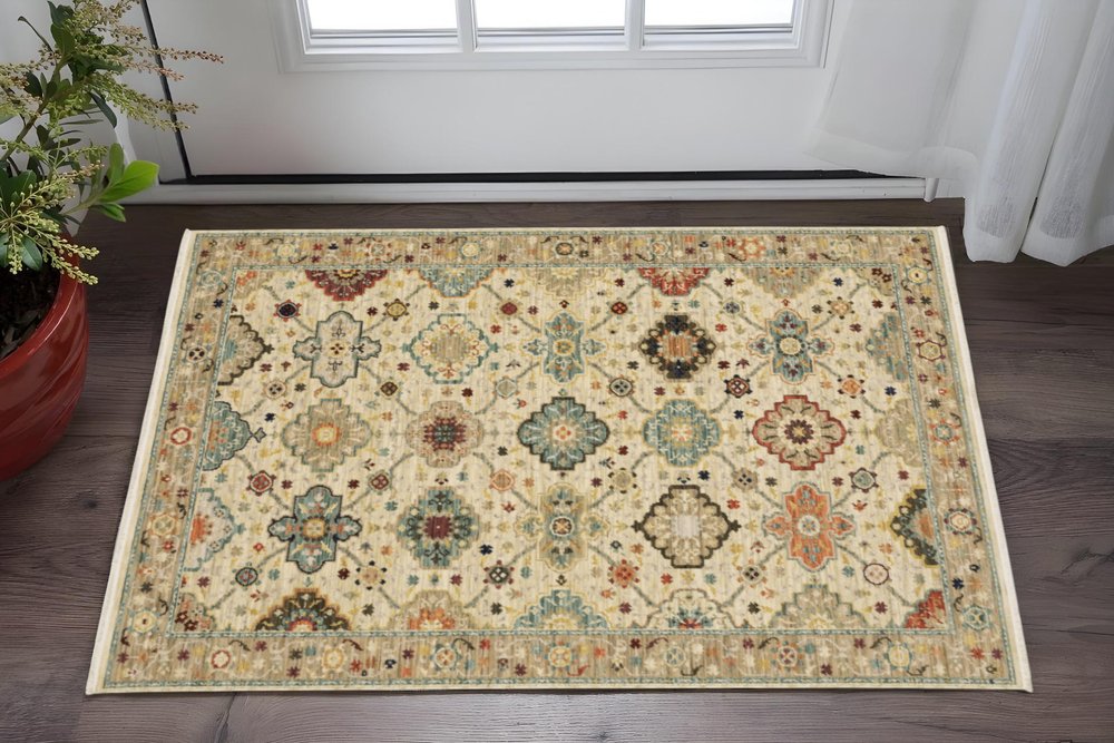 6' X 9' Beige Pale Blue Rust Gold Tan Brown And Orange Oriental Power Loom Stain Resistant Area Rug With Fringe