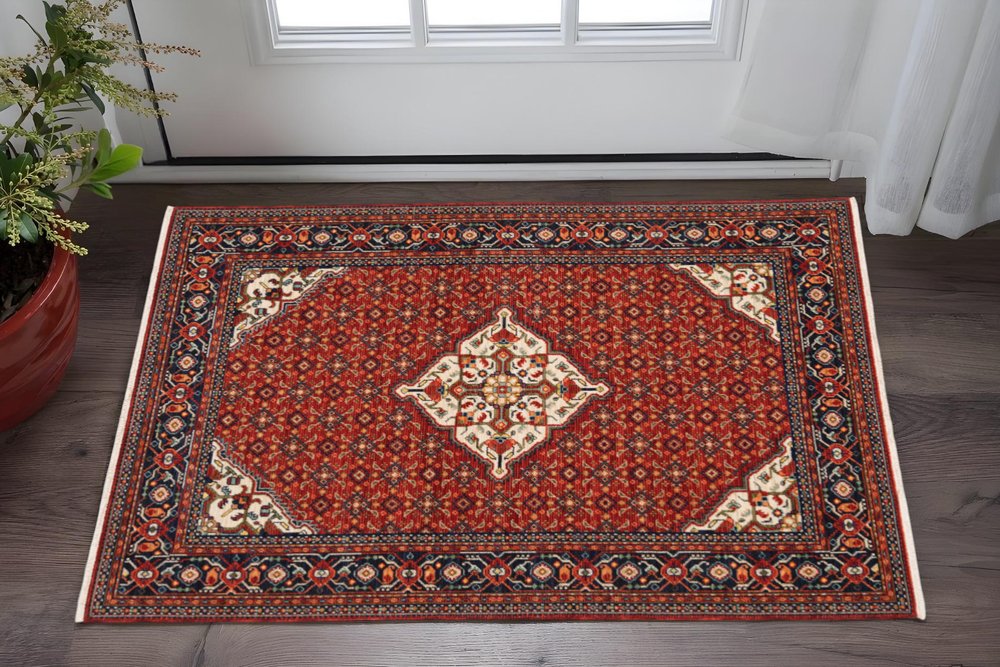 2' X 3' Red Blue Ivory And Orange Oriental Power Loom Stain Resistant Area Rug With Fringe
