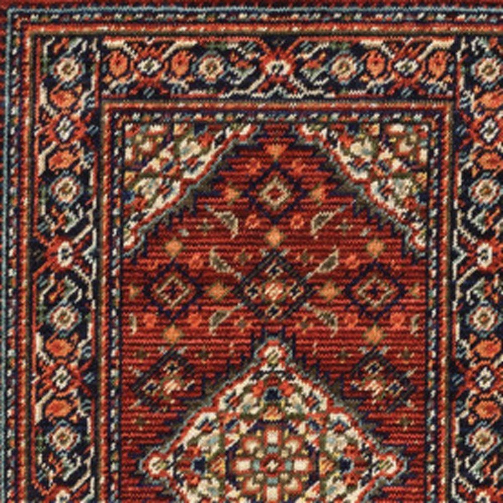 2' X 3' Red Blue Ivory And Orange Oriental Power Loom Stain Resistant Area Rug With Fringe