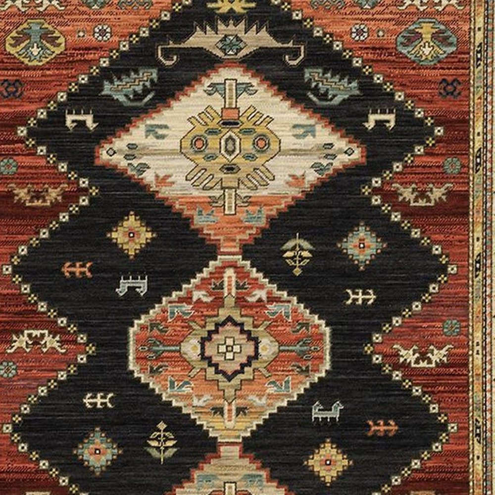 2' X 3' Charcoal Brown Orange Salmon Gold Navy Ivory And Pale Blue Oriental Power Loom Stain Resistant Area Rug With Fringe