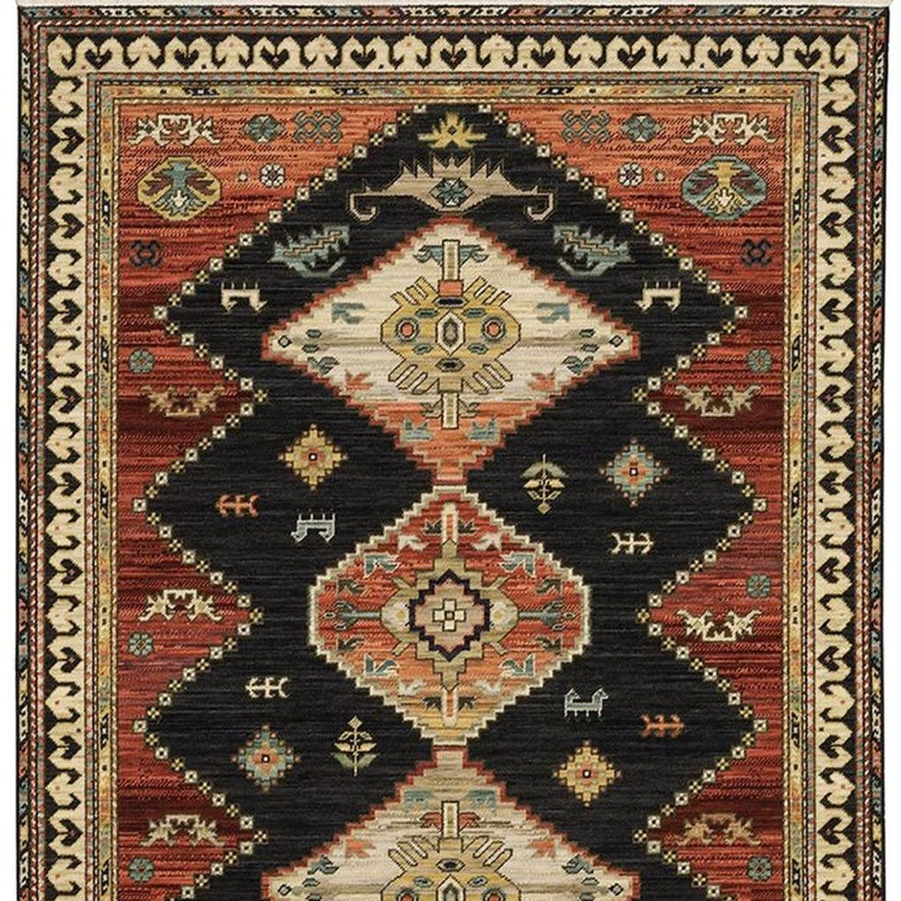 2' X 3' Charcoal Brown Orange Salmon Gold Navy Ivory And Pale Blue Oriental Power Loom Stain Resistant Area Rug With Fringe