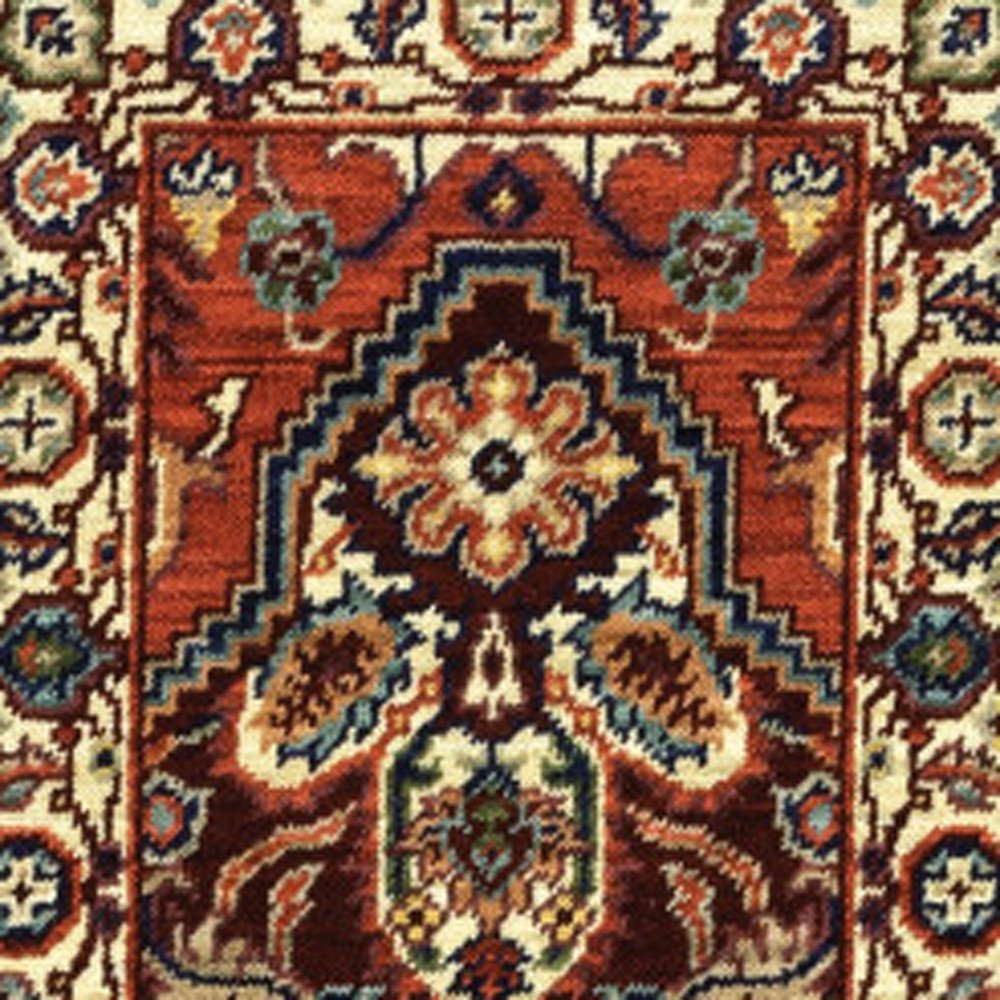 5' X 8' Red Ivory Orange And Blue Oriental Power Loom Stain Resistant Area Rug With Fringe
