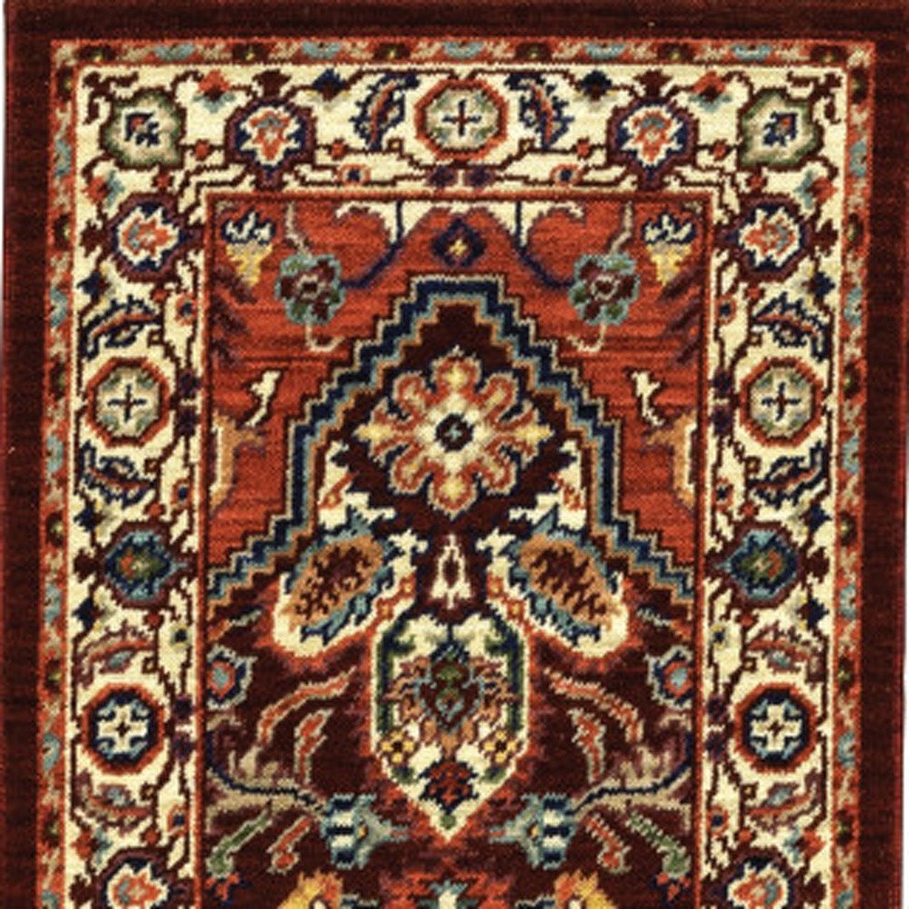 5' X 8' Red Ivory Orange And Blue Oriental Power Loom Stain Resistant Area Rug With Fringe