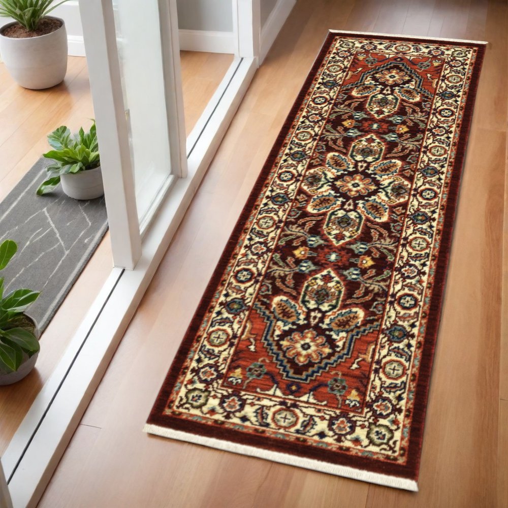 5' X 8' Red Ivory Orange And Blue Oriental Power Loom Stain Resistant Area Rug With Fringe