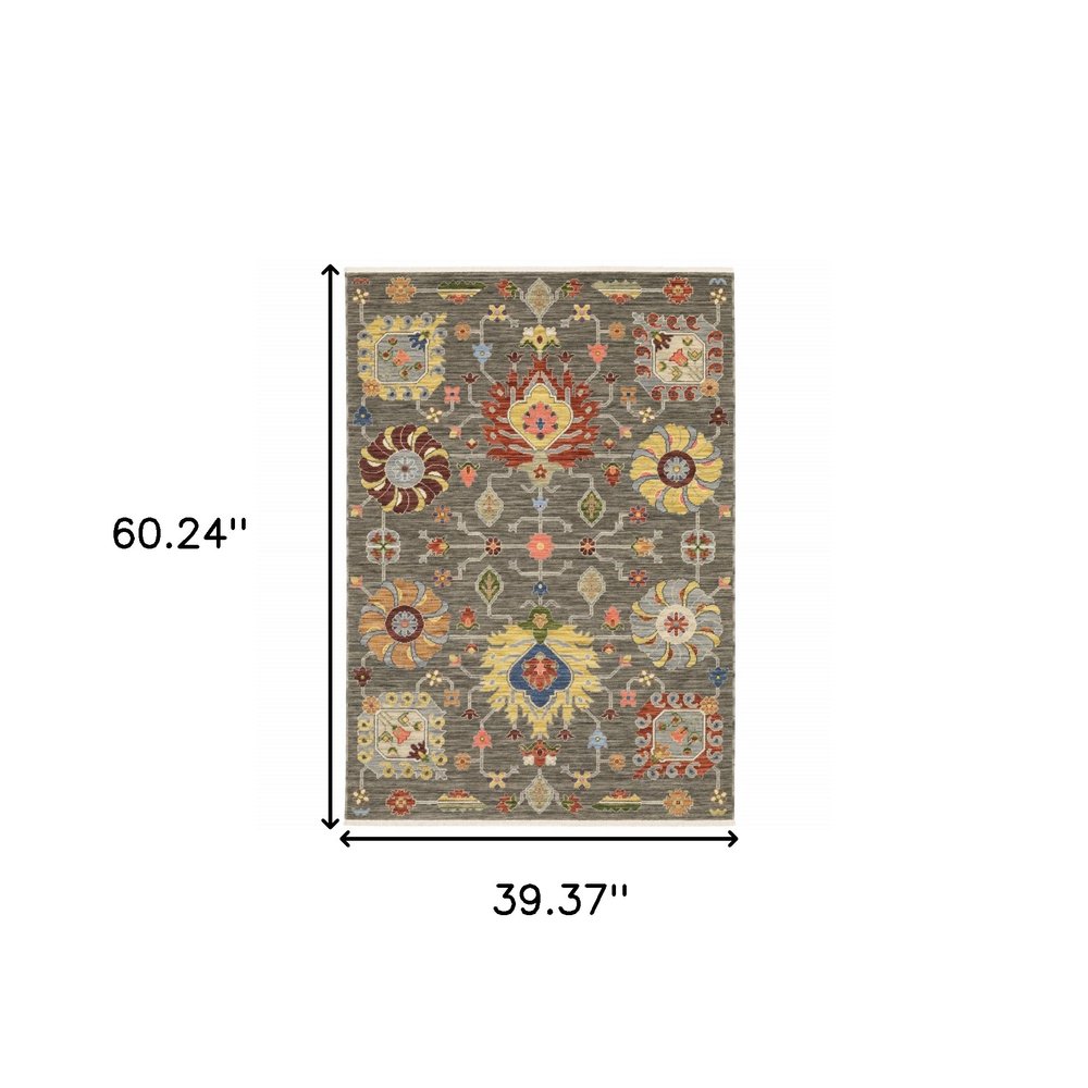 8' X 11' Grey Charcoal Yellow Blue Rust Red Pink Green And Ivory Oriental Power Loom Stain Resistant Area Rug With Fringe