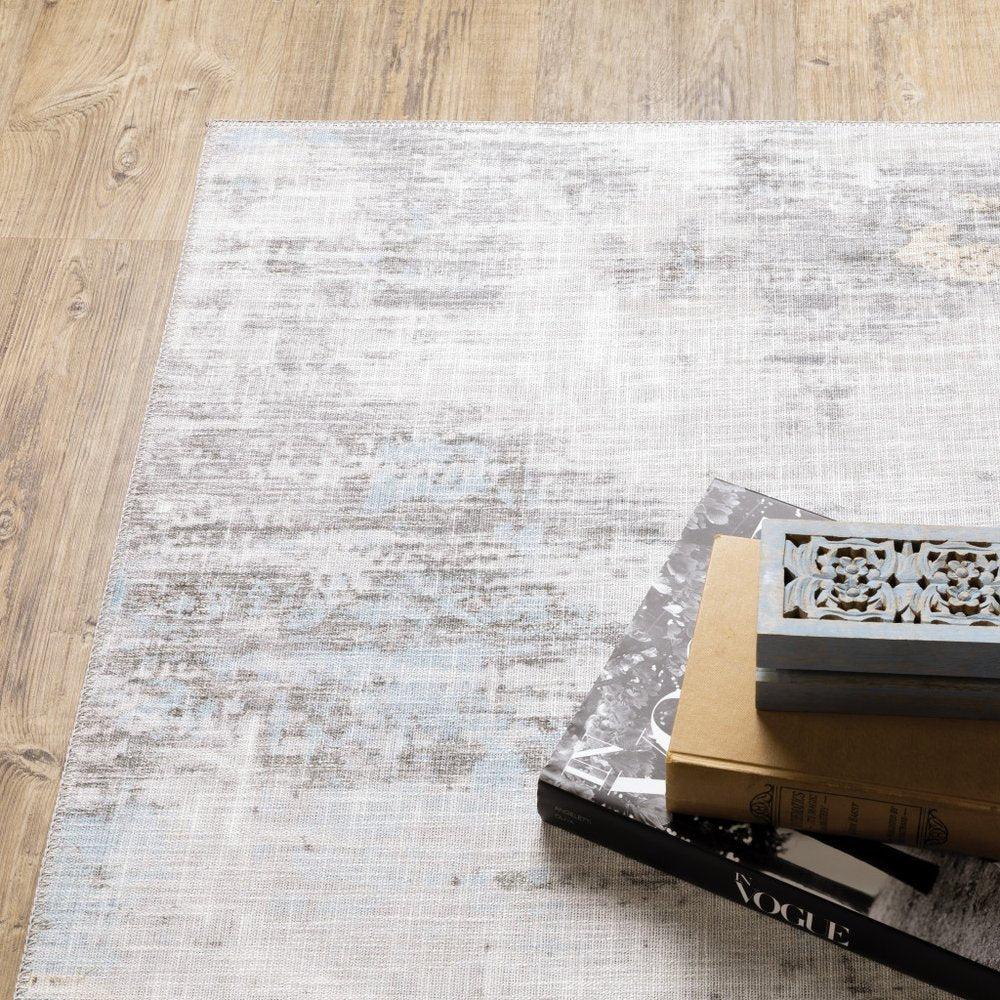 9' X 12' Beige And Gray Abstract Distressed Area Rug