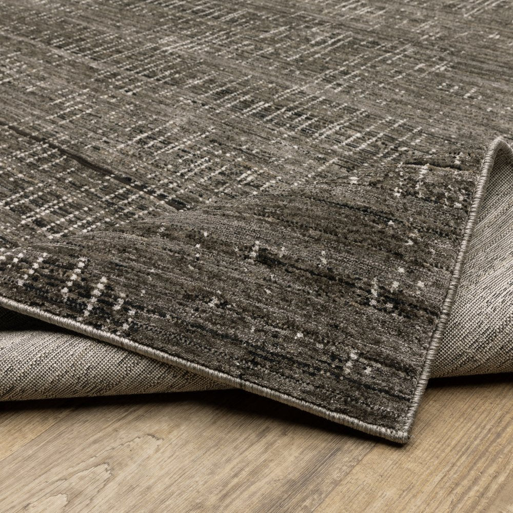 10' X 13' Charcoal Grey Grey Ivory Tan And Brown Abstract Power Loom Stain Resistant Area Rug