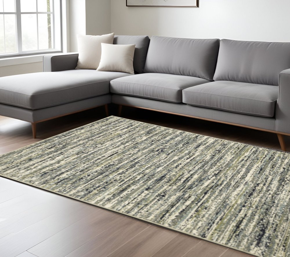 10' X 13' Blue Green Light Blue Grey And Ivory Abstract Power Loom Stain Resistant Area Rug