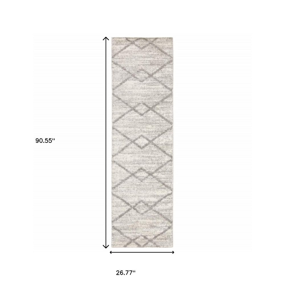 5' X 8' Ivory And Grey Geometric Shag Power Loom Stain Resistant Area Rug
