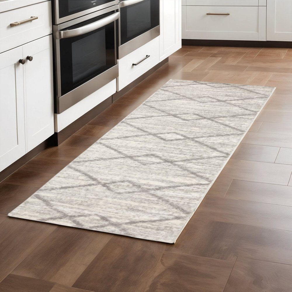 5' X 8' Ivory And Grey Geometric Shag Power Loom Stain Resistant Area Rug