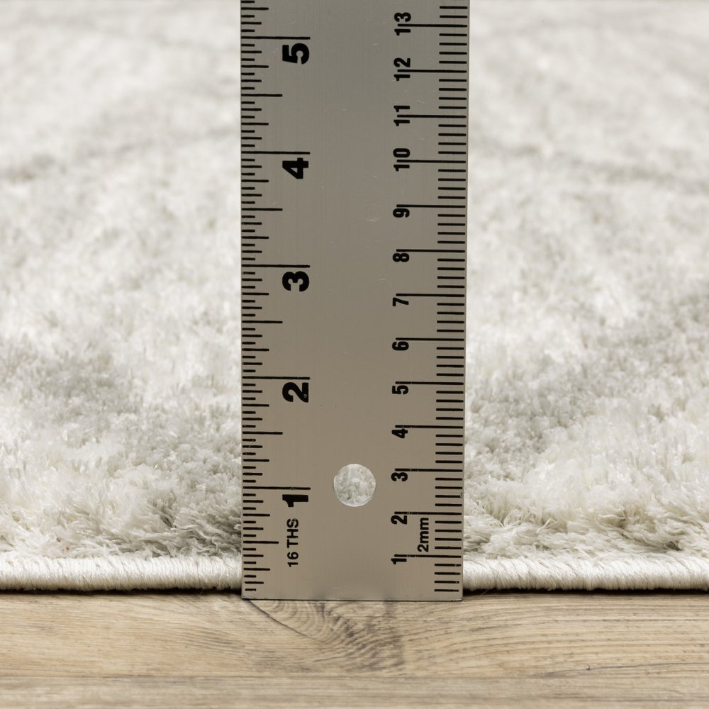 5' X 8' Ivory And Grey Geometric Shag Power Loom Stain Resistant Area Rug