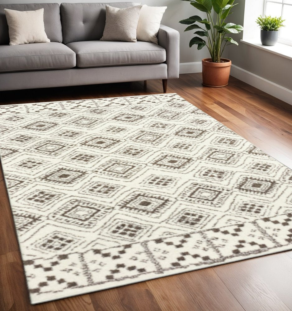 4' X 6' Ivory And Brown Geometric Shag Power Loom Stain Resistant Area Rug