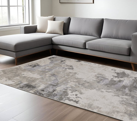5' X 8' Ivory And Gray Abstract Stain Resistant Area Rug