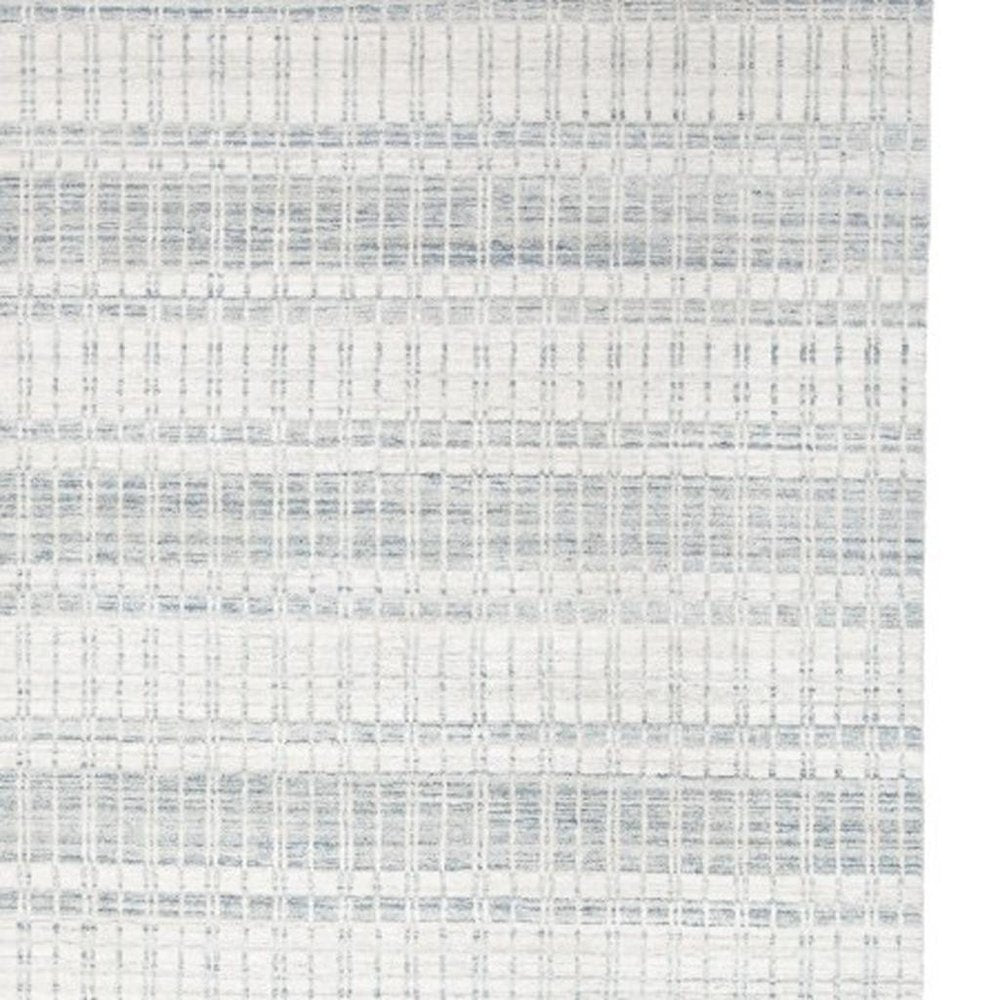 7' X 9' Ivory And Blue Striped Hand Woven Area Rug
