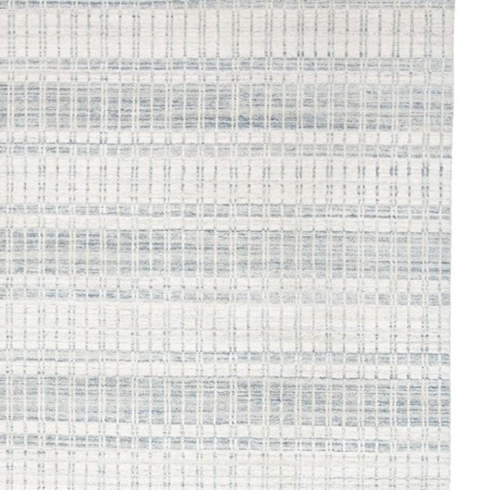 7' X 9' Ivory And Blue Striped Hand Woven Area Rug