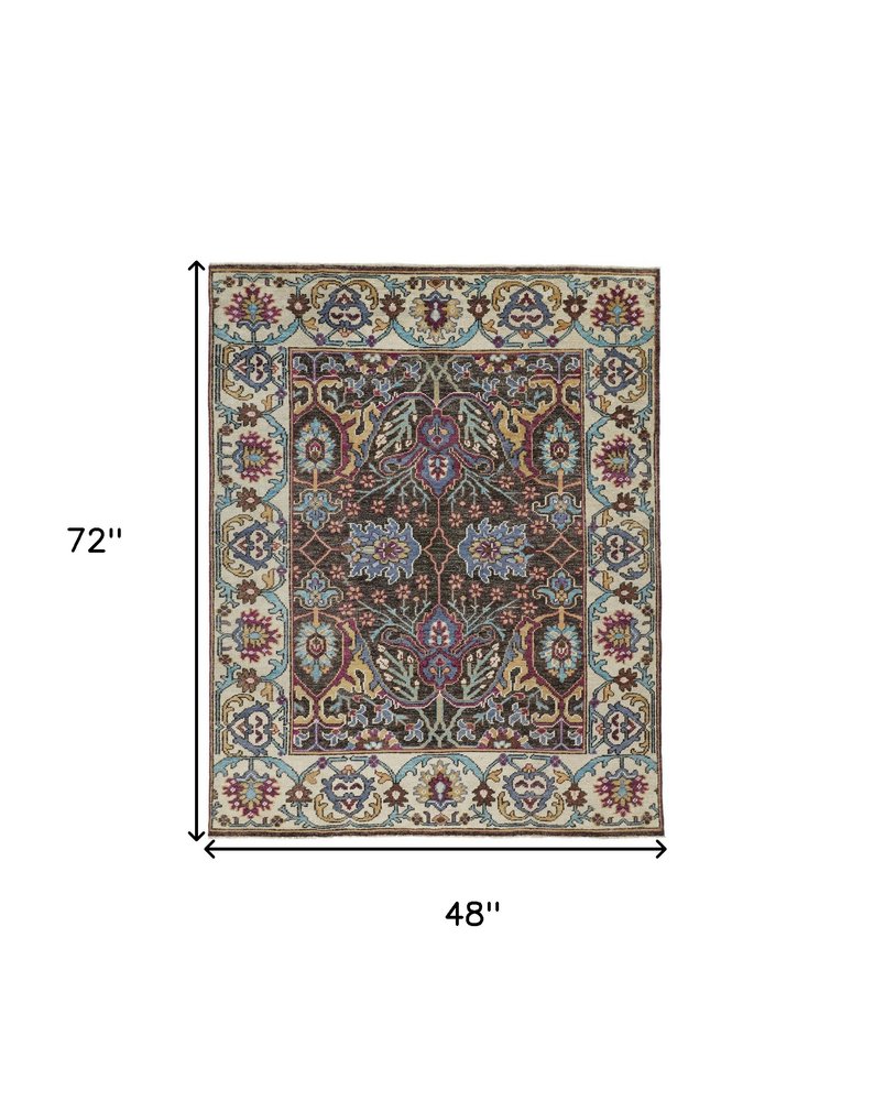 2' X 3' Ivory and Blue Wool Floral Hand Knotted Distressed Area Rug With Fringe