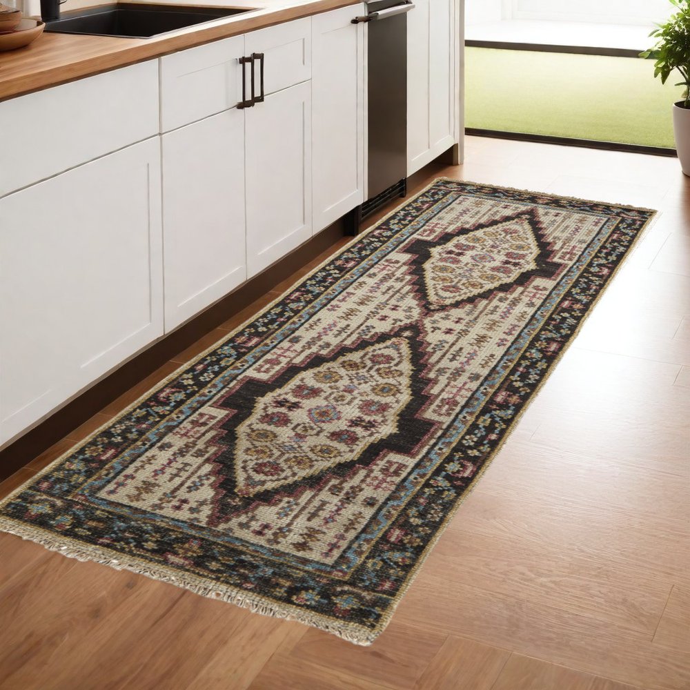 8' Green and Ivory Wool Floral Hand Knotted Distressed Runner Rug With Fringe