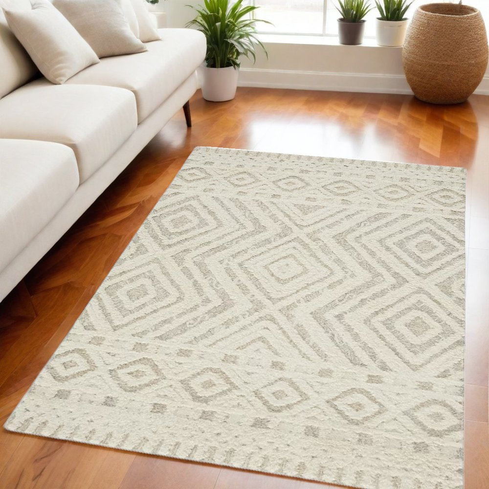 4' X 6' Ivory And Tan Wool Geometric Tufted Handmade Stain Resistant Area Rug