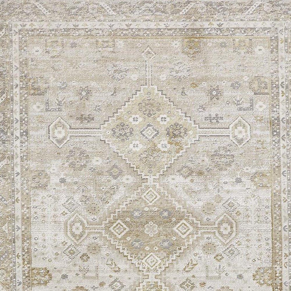5' X 8' Gold And Ivory Floral Stain Resistant Area Rug