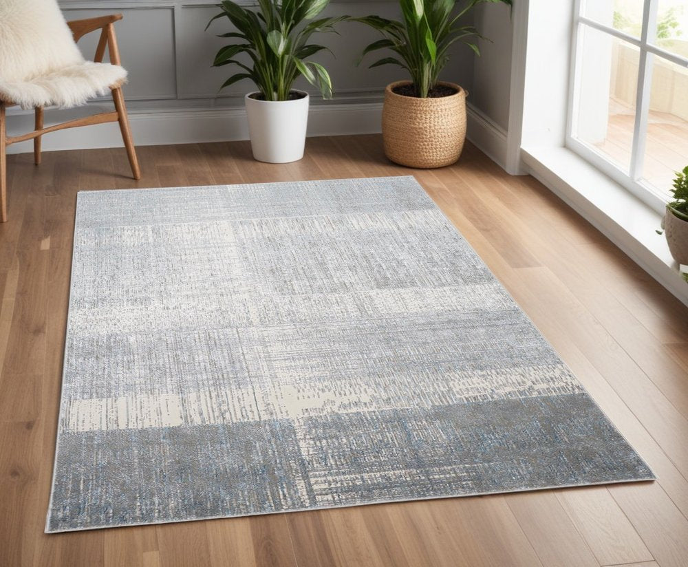 5' X 8' Blue And Gray Abstract Area Rug