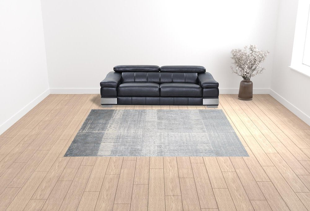 5' X 8' Blue And Gray Abstract Area Rug