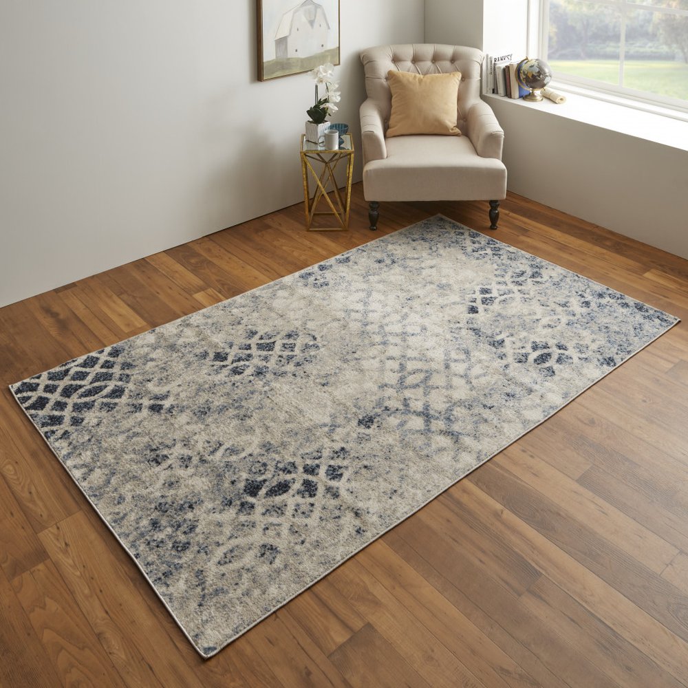 7' X 10' Ivory And Blue Abstract Power Loom Distressed Area Rug