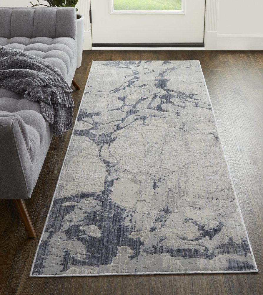 4' X 6' Ivory And Blue Abstract Power Loom Distressed Area Rug