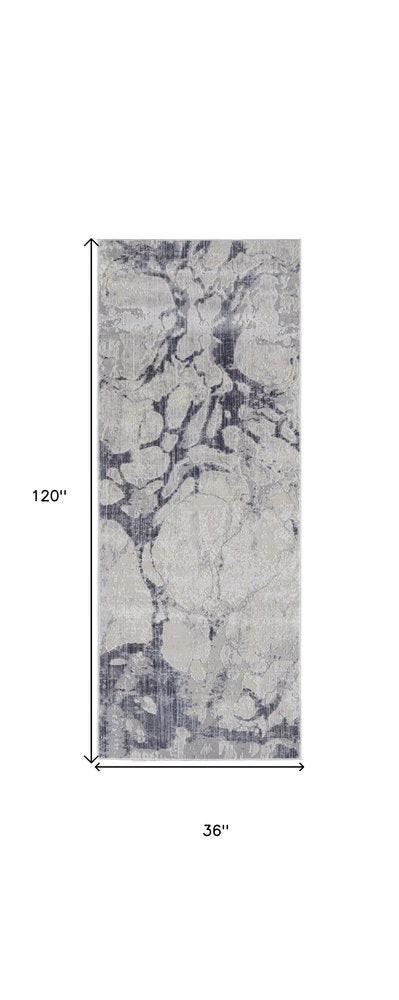 4' X 6' Ivory And Blue Abstract Power Loom Distressed Area Rug