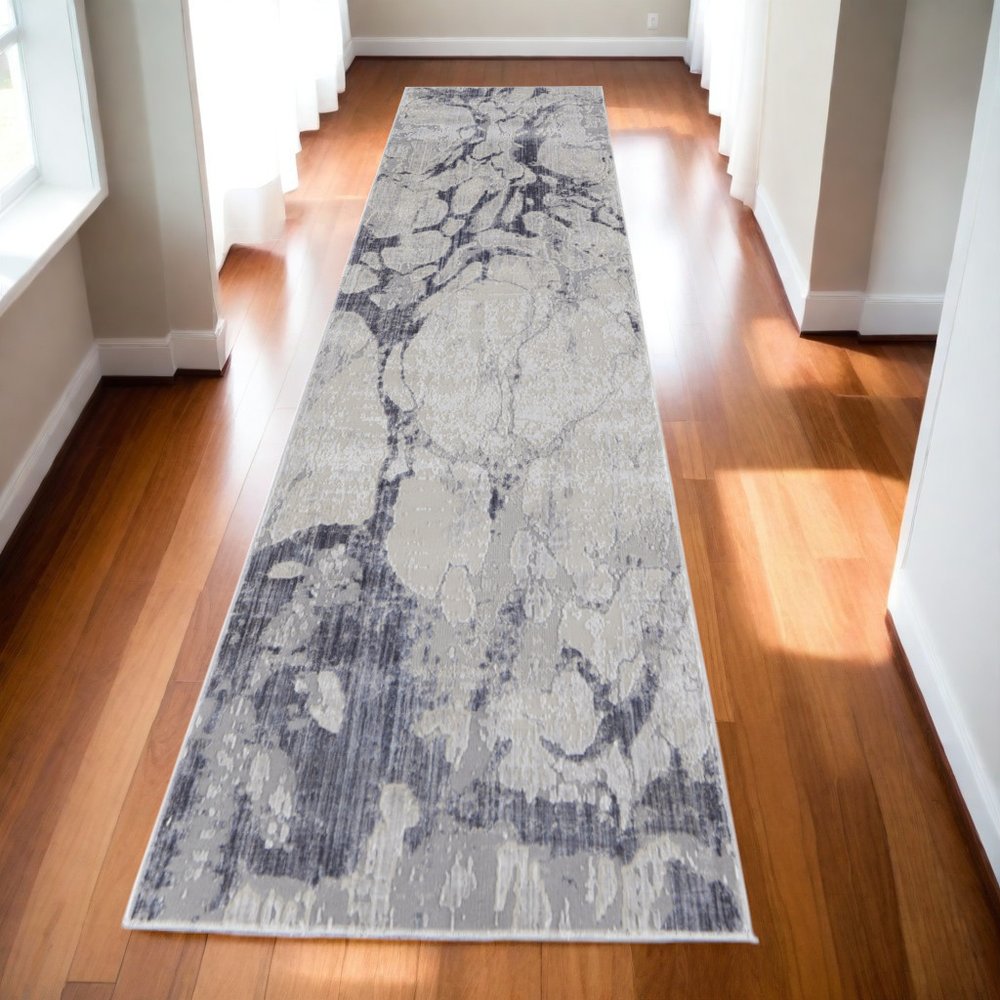 4' X 6' Ivory And Blue Abstract Power Loom Distressed Area Rug
