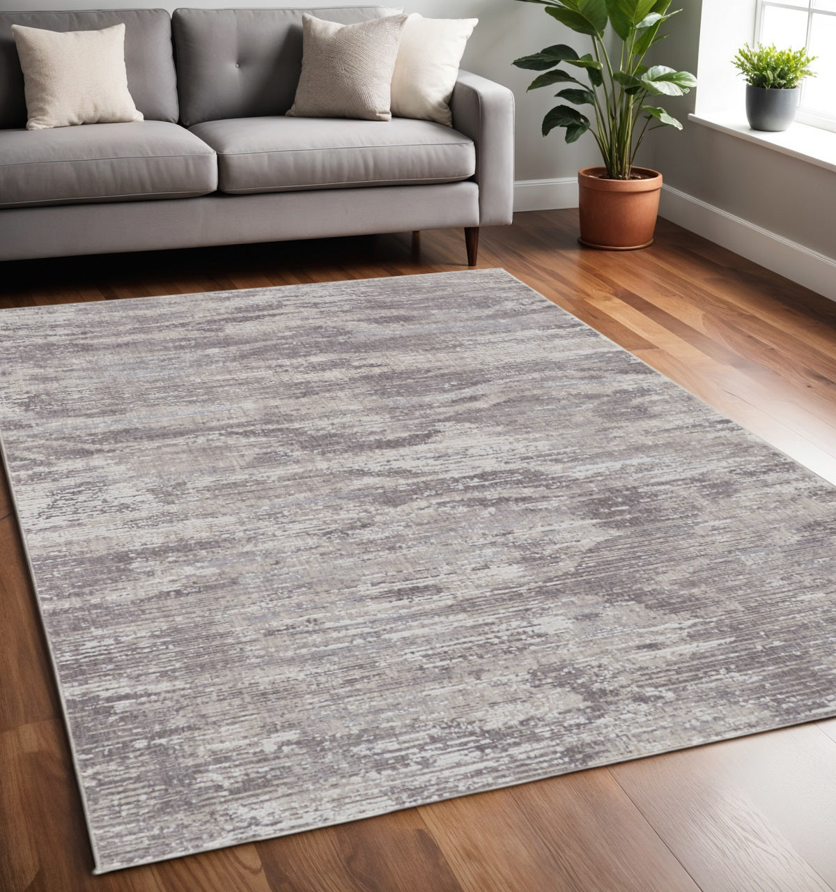 4' X 6' Tan and Gray Abstract Power Loom Distressed Area Rug