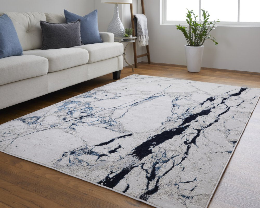 2' X 3' Ivory and Blue Marble Power Loom Distressed Area Rug
