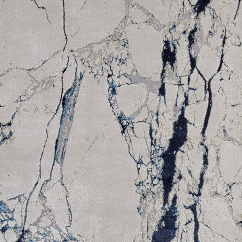 2' X 3' Ivory and Blue Marble Power Loom Distressed Area Rug