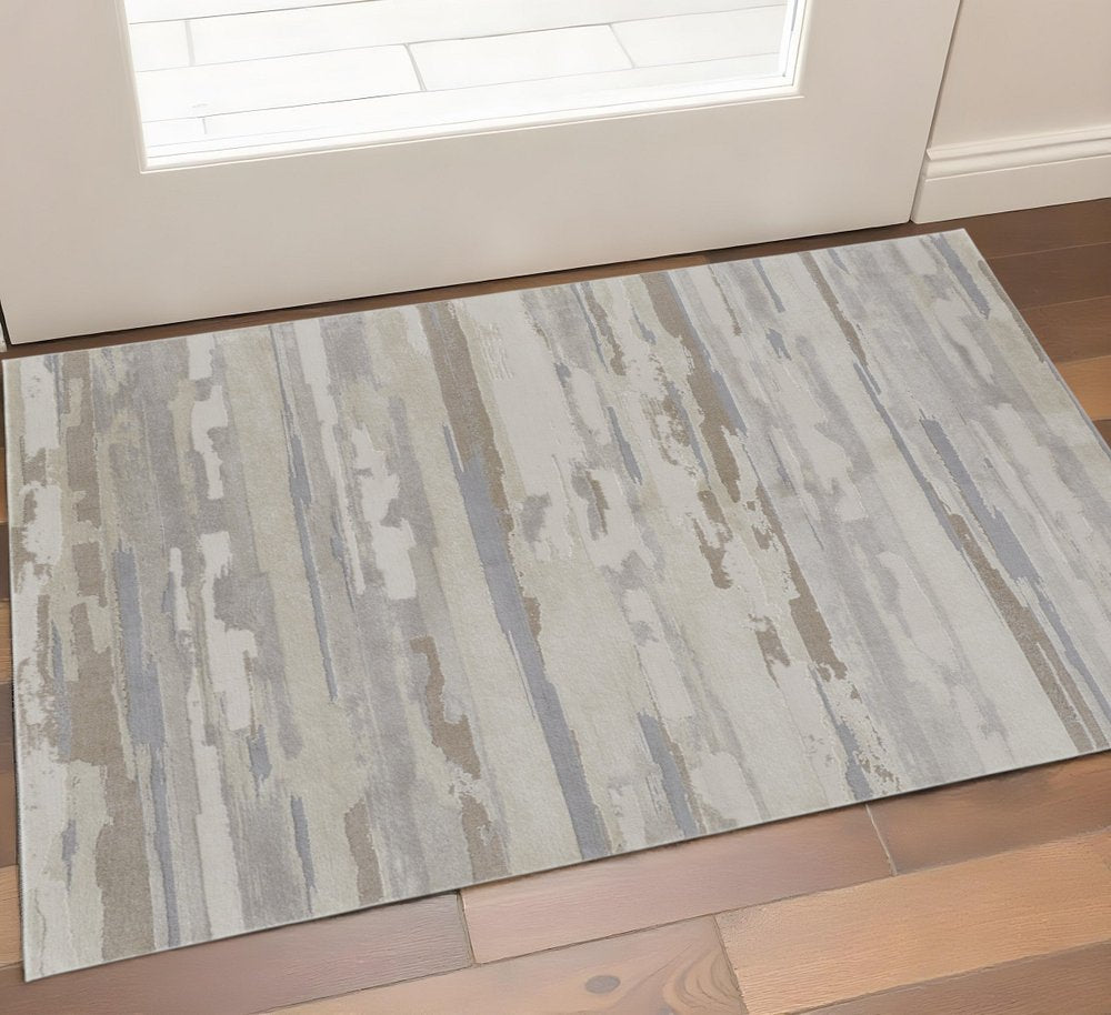 2' X 3' Brown Ivory And Tan Abstract Distressed Area Rug