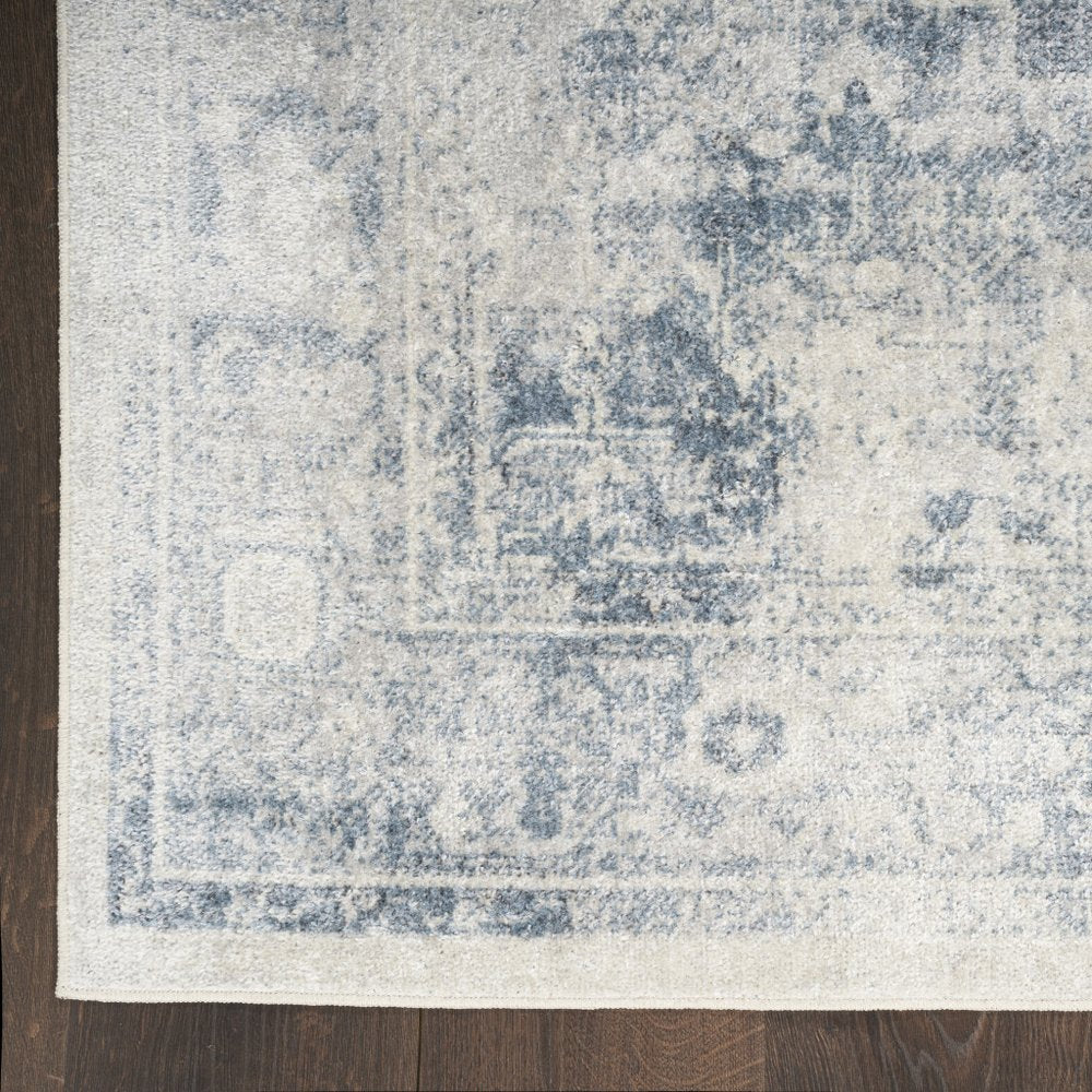 9' X 12' Blue and Ivory Oriental Power Loom Distressed Area Rug
