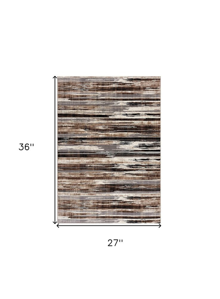 2' X 3' Brown Ivory and Tan Abstract Washable Non Skid Area Rug