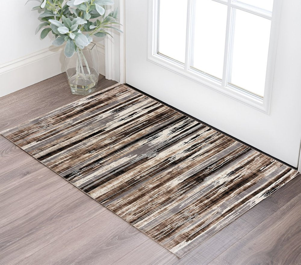 2' X 3' Brown Ivory and Tan Abstract Washable Non Skid Area Rug