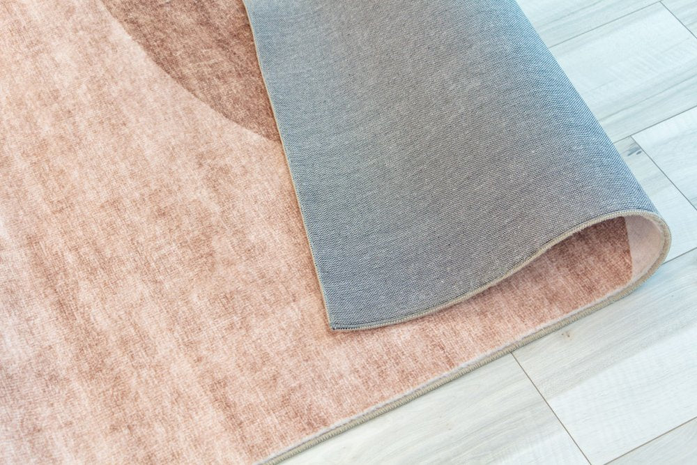 5' X 8' Beige and Green Abstract Distressed Area Rug