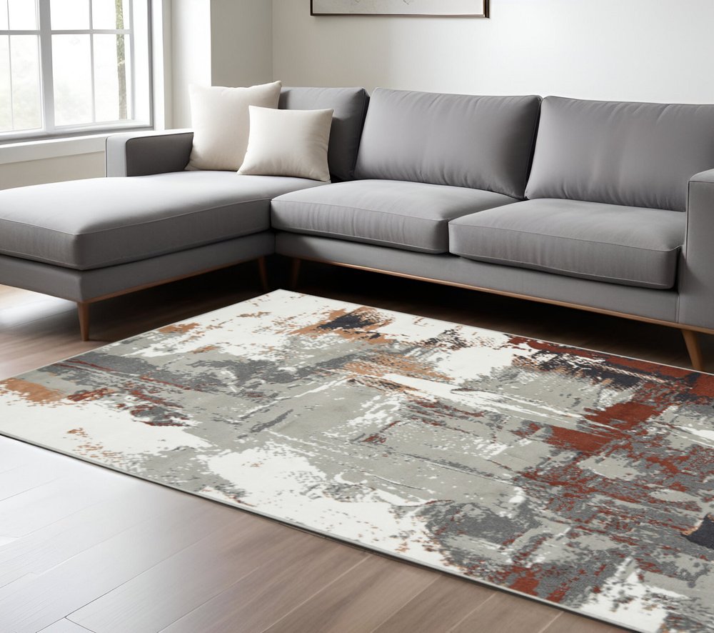 8' X 10' Ivory Gray and Rust Abstract Power Loom Area Rug