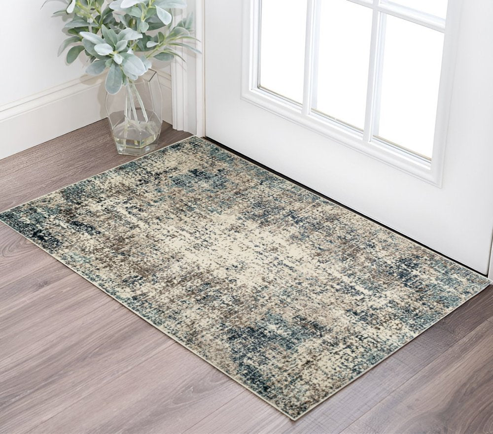 9' X 12' Ivory Blue and Gray Abstract Power Loom Area Rug