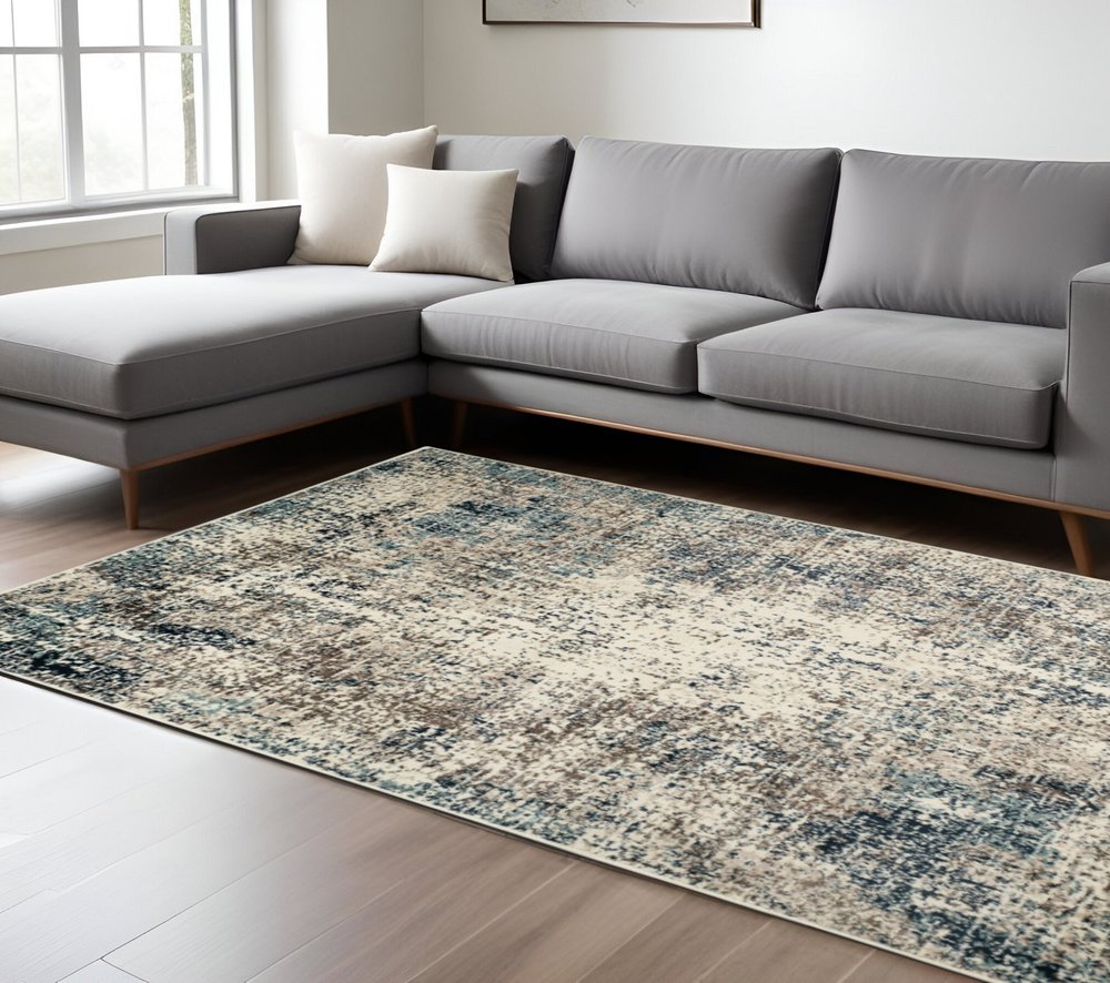 9' X 12' Ivory Blue and Gray Abstract Power Loom Area Rug