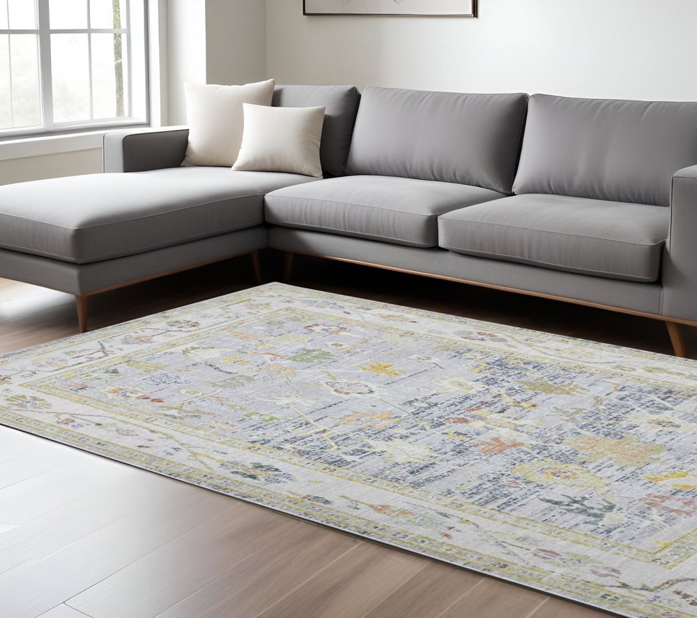 9' X 13' Ivory Blue And Green Floral Area Rug