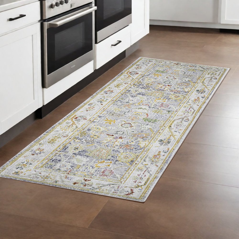 9' X 13' Ivory Blue And Green Floral Area Rug
