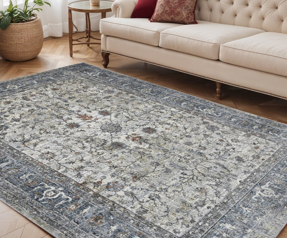 5' X 8' Ivory Blue And Gray Oriental Area Rug