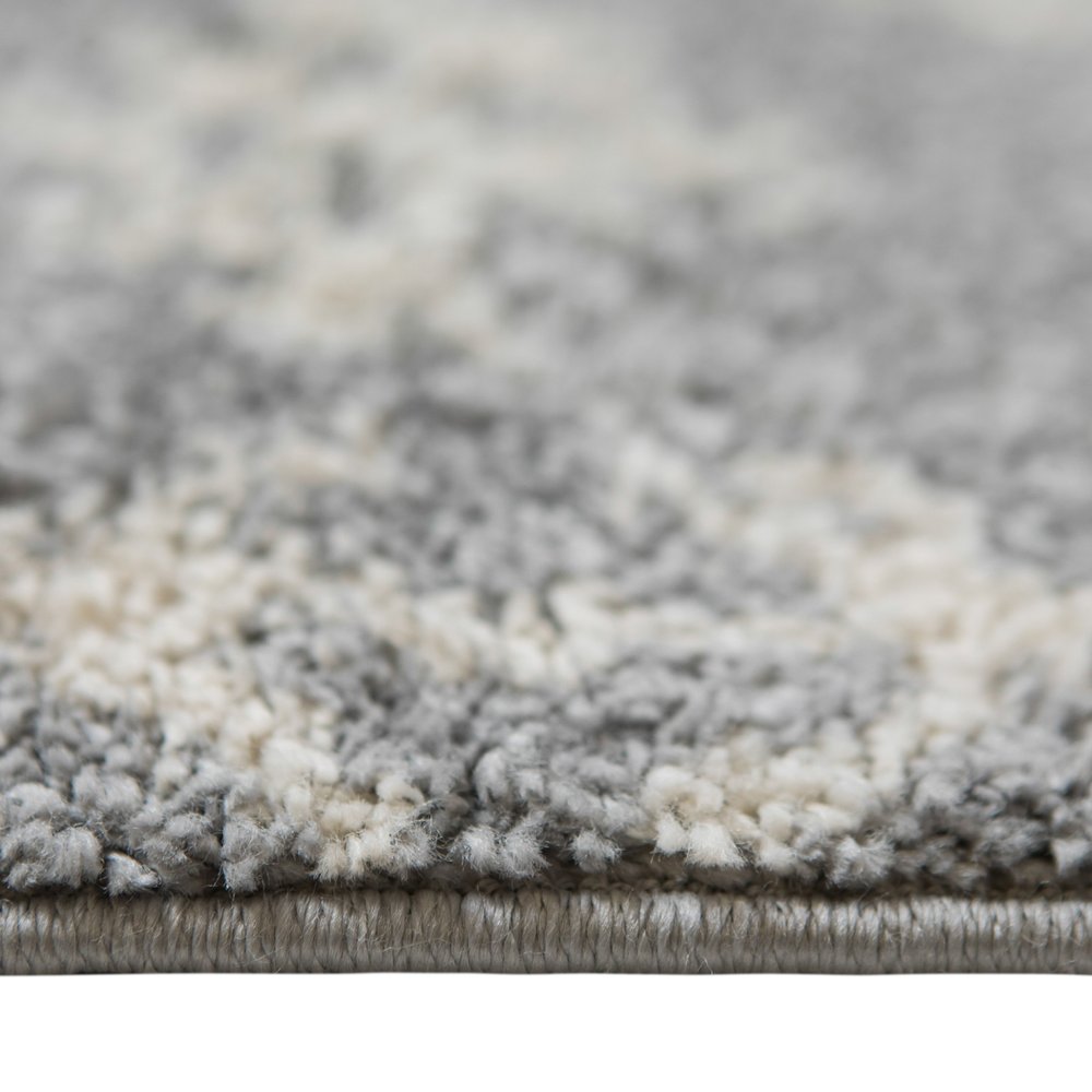 5' X 8' Gray And Ivory Geometric Shag Area Rug