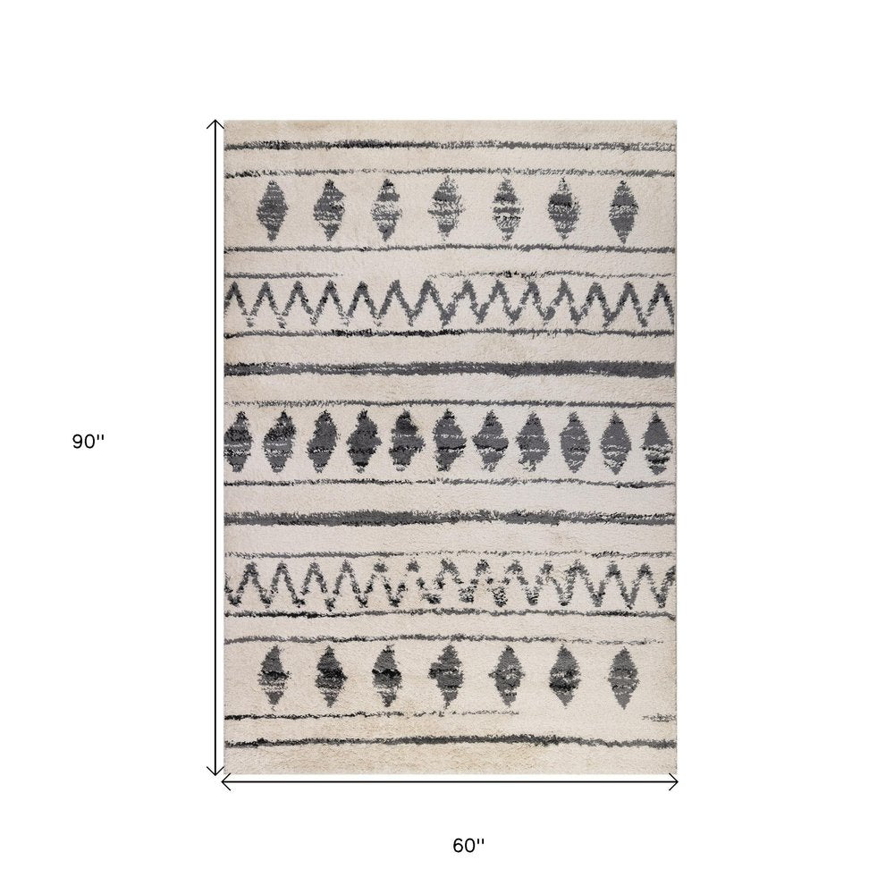 5' X 8' Cream Black And Gray Geometric Shag Area Rug